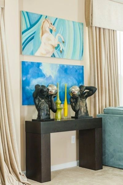 Console table vignette with sculptural busts